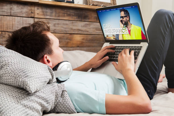 istock Man researching car insurance on the internet with a laptop. 681671894