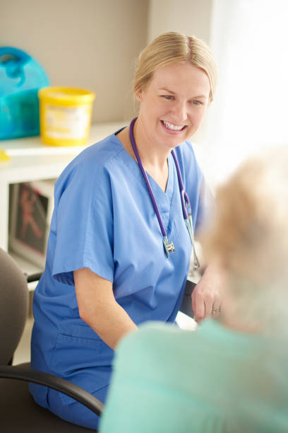 istock happy doctor and senior patient chatting 681695376