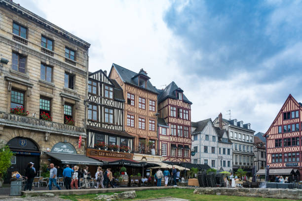 Rouen, France - September 4, 2016: Place du vieux marché in Rouen. There's full of restaurants, shops, ... In the center, there's also the Church of St Joan of Arc
