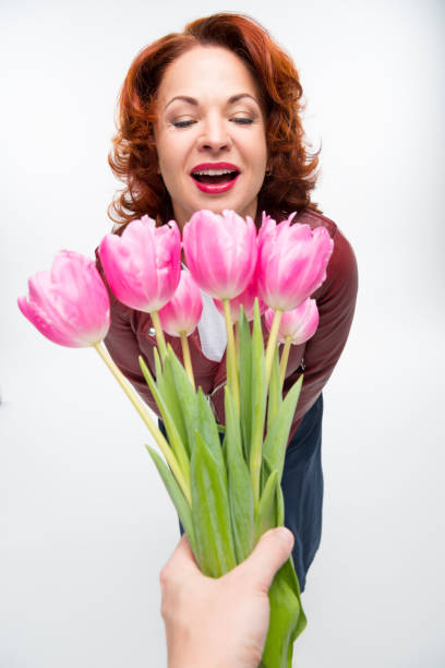 istock Man presenting flowers to woman 681697820