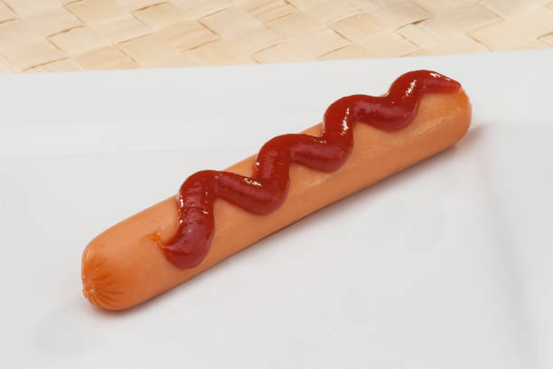 istock Chicken Sausage with ketchup swirls isolated 681712362