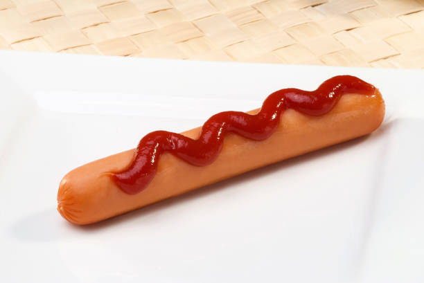 istock Chicken Sausage with ketchup swirls isolated 681712380