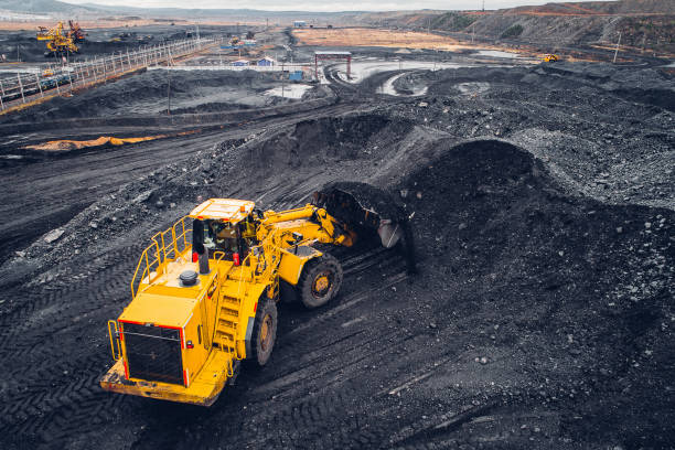 Coal mining at an open pit Coal mining at an open pit from above. coal mine photos stock pictures, royalty-free photos & images