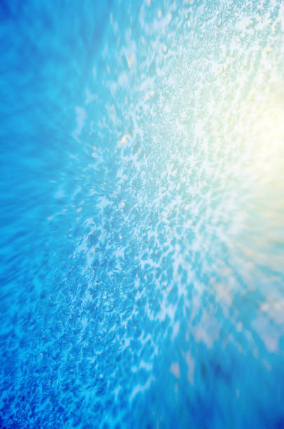 istock Tilt-shift effect on frozen window sunbeam sun flare 681714346