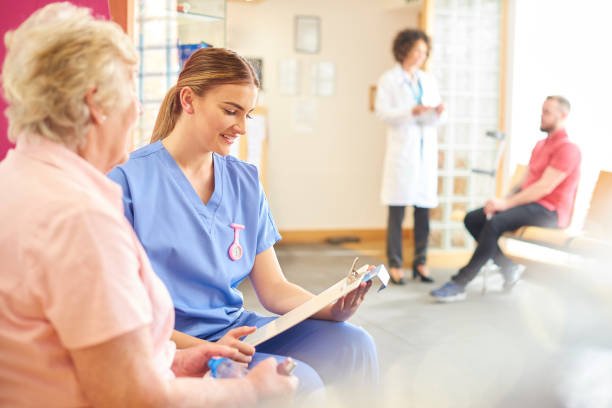istock Female nurse taking senior patient's details 681719500