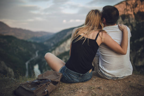 istock Couple relaxing on mountain 681719808