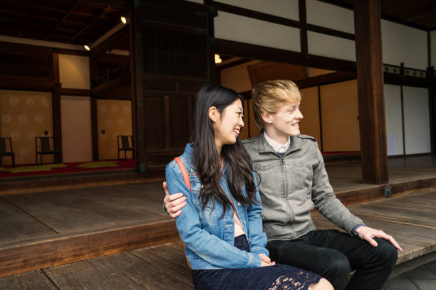 istock Young couple coming to a temple for sightseeing 681722018