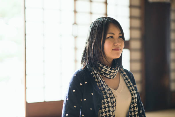 istock Young woman coming to a temple for sightseeing 681722364