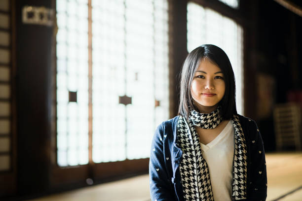 istock Young woman coming to a temple for sightseeing 681722366