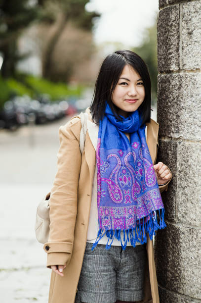 istock Young woman standing in city 681722678