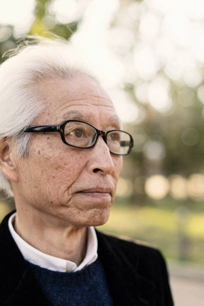 istock Senior man standing in green 681723102