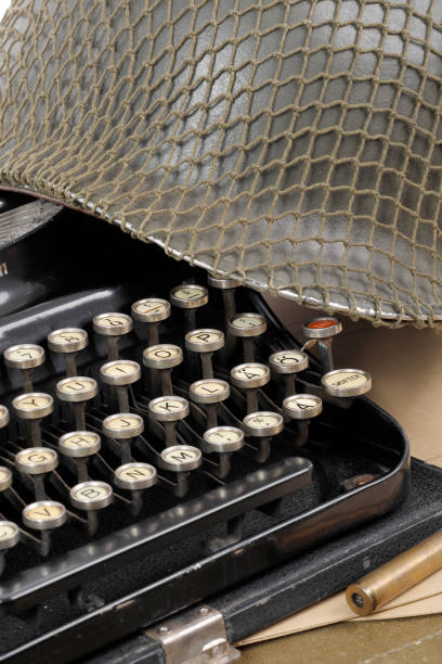 istock US military helmet of the Second World War with old typewriter 681723674
