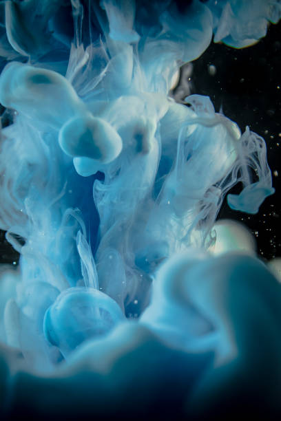 istock blue ink in water isolated on black background 681723846