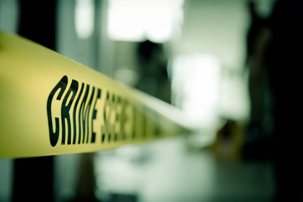 crime scene tape of  mysterious case in cenematic tone with copy space stock photo