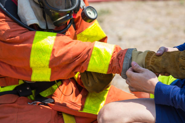 istock firefighters buddy help to wearing fire protection gloves 681729022