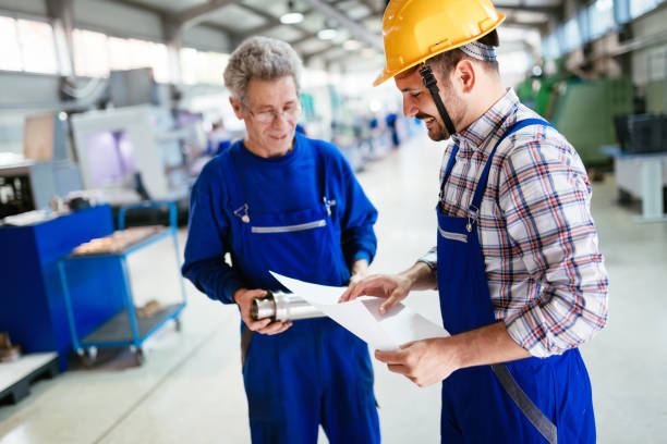 istock Team Of Engineers Having Discussion In Factory 681732432