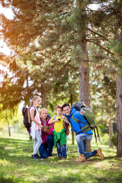istock Happy parents hiking with their child 681732882