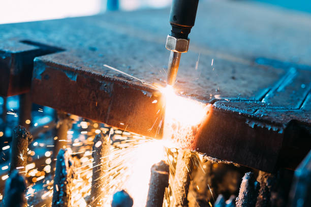 istock Oxygen torch cuts steel sheet. CNC gas cutting machine. Bright sparks 681733008