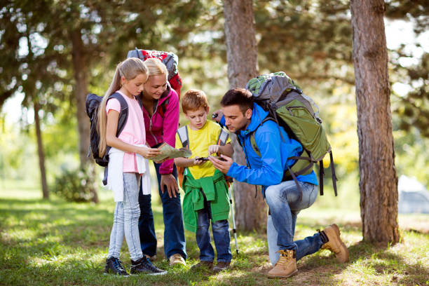 istock parents and child hiking 681733172