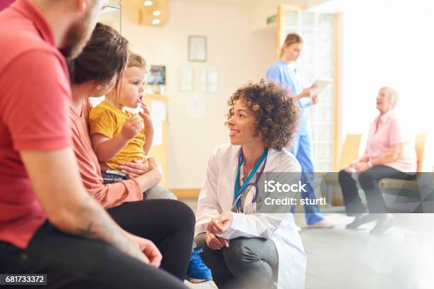 Toddler Talking To Female Doctor Stock Photo - Download Image Now - Doctor, Healthcare And Medicine, Child