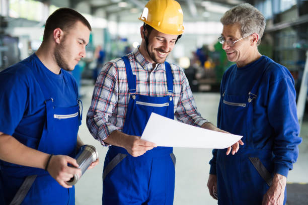istock Team Of Engineers Having Discussion In Factory 681733636