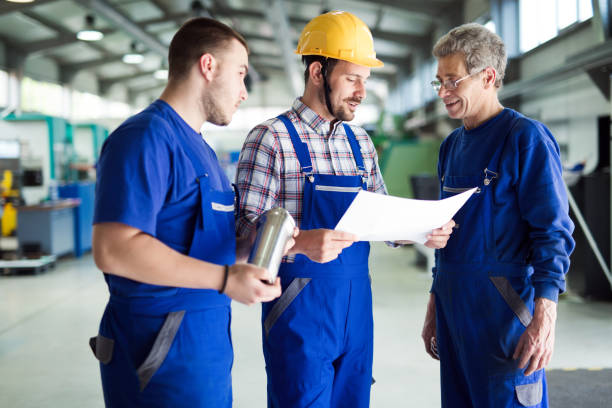 istock Team Of Engineers Having Discussion In Factory 681734060