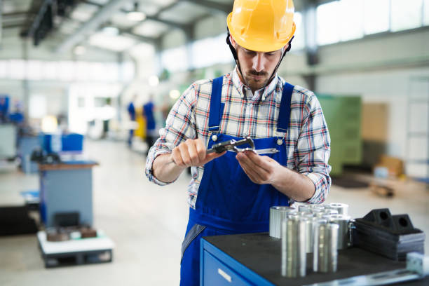 istock Portrait of an handsome engineer in a factory 681734076