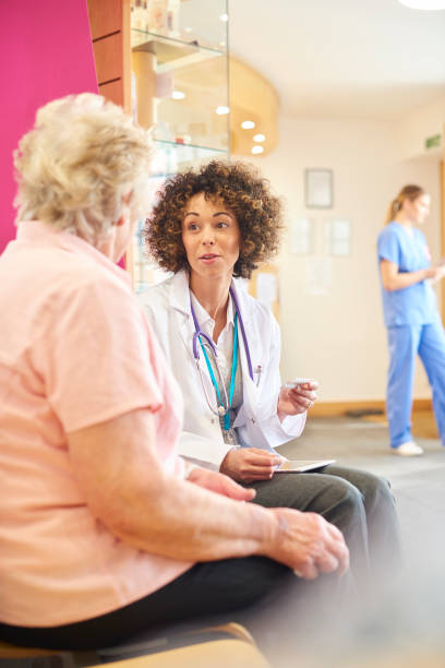 istock Female doctor advising senior patient on medication usage 681734336