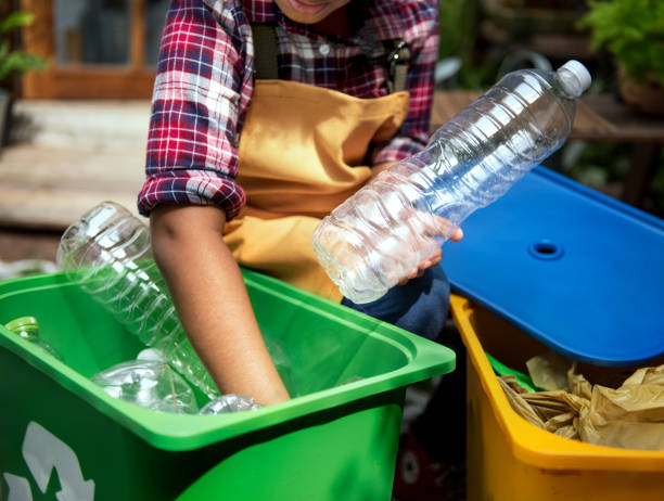 istock African Descent Kid Separating Recyclable Trash 681737572