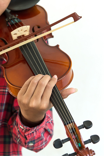Young man playing violin in isolated white background.Copy space.