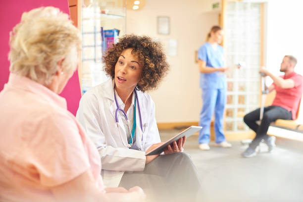 istock Senior patient chatting to female doctor 681740030