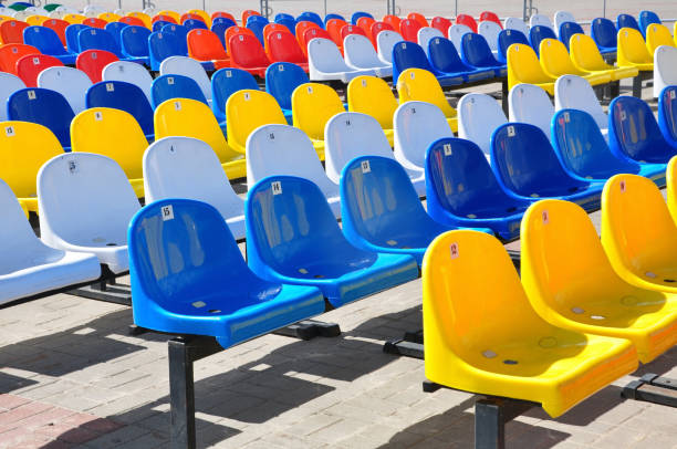 istock Rows of colorful plastic chairs on the front side. 681747794