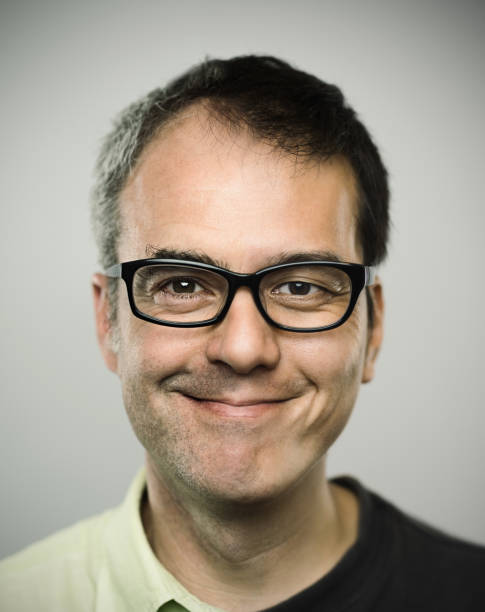 istock Excited mman smiling against gray background 681753332