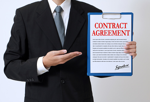 woman showing a written contract agreement