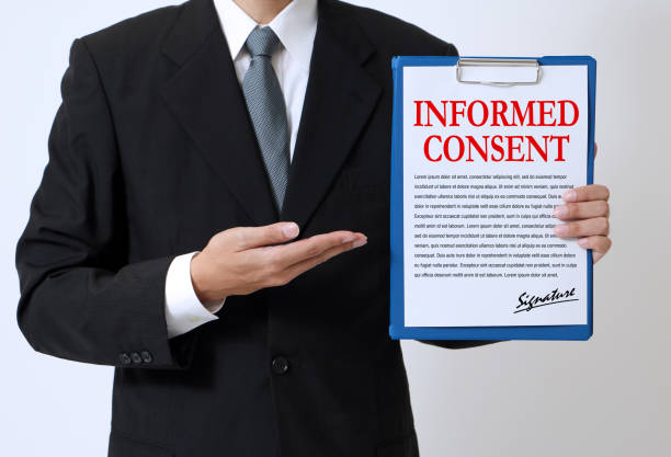 istock woman showing a written informed consent 681766098