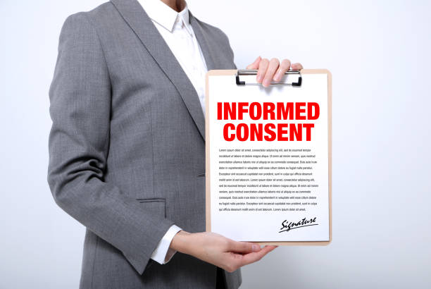 woman showing a written informed consent