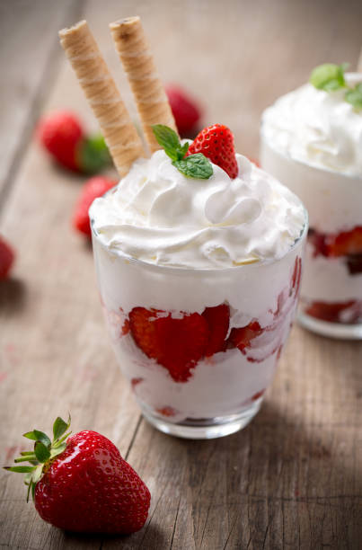 istock red strawberries with whipped cream dessert 681767652