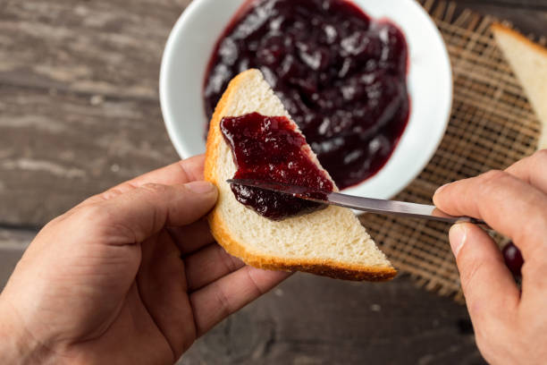 istock Breakfast of cherry jam on toast 681774292