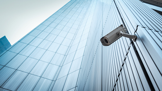 Outdoor CCTV Security camera installed on the building wall in the city