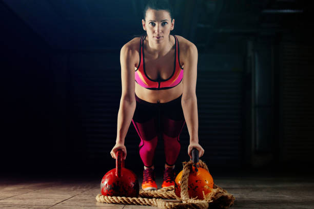 istock Young Woman Exercising in the gym 681791608