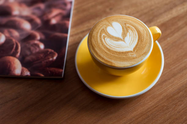 istock Hot latte art on wood table 681791744