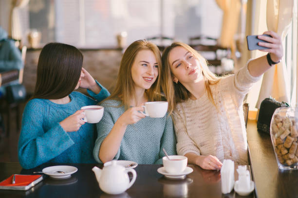 istock girls in cafe 681791780