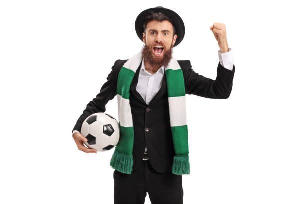 istock Euphoric football fan with a scarf cheering 681792396