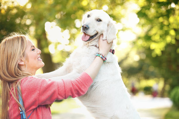 istock Young Woman Walking With Her Dog 681796160
