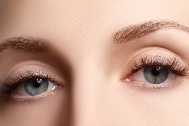istock Macro shot of woman's beautiful eye with extremely long eyelashe 681800106