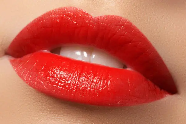 Woman's lips with red lipstick. Beauty and fashion