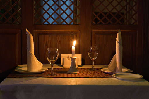 Romantic candle light dinner in a restaurant.