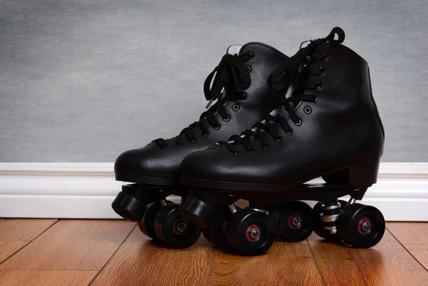 istock men's quad roller skates on wood floor 681806908