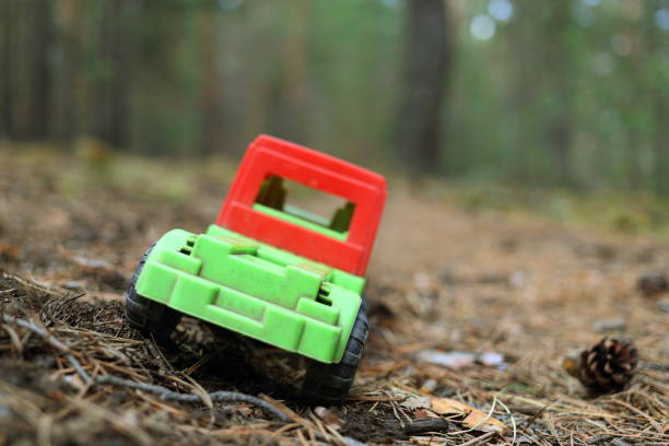 istock Toy truck on a forest road 681807654