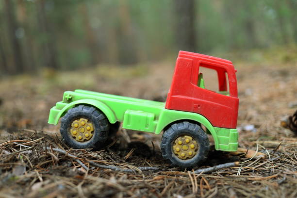 istock Toy truck on a forest road 681807702